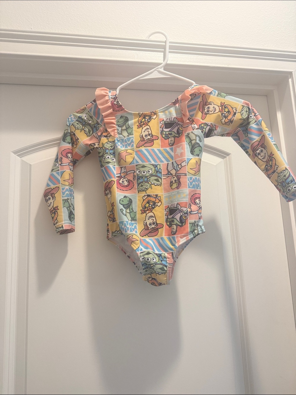 Disney Kids One-Piece Bodysuit in Pastel Multi-Color Toy Story Print